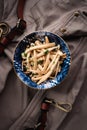 Shimeji mushrooms in a bowl on grey chef`s apron background. Pickled japanese brown beech or buna shimeji. Umami taste. Vegetarian Royalty Free Stock Photo