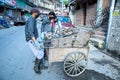 Shimla, Himachal Pradesh, india - July 20th, 2019: Indian Asian Garbage man collecting garbage in the garbage cart. Concept about