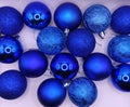 Shimmering Blue Christmas Ornaments on White Background