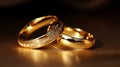 Shimmering gold wedding rings on glittering background - perfect symbol of eternal love Royalty Free Stock Photo