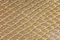 Golden background of scales similar to snakeskin with rhomboid s