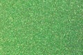 Shimmering GREEN background in glittery material ideal as a very