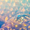 Shimmering iridescent bubble wrap surface with soft glowing bokeh background Royalty Free Stock Photo