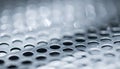 Shimmering Light on a Perforated Metal Surface Royalty Free Stock Photo