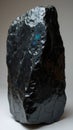 Shimmering obsidian boulder with rainbow hues and razor sharp edges Royalty Free Stock Photo