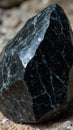 Shimmering obsidian boulder with rainbow hues and razor sharp edges Royalty Free Stock Photo