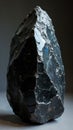 Shimmering obsidian boulder with rainbow hues and razor sharp edges Royalty Free Stock Photo