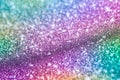 Shimmering purple sandy background with wavy texture and blur. Macro image of a metallized shiny multicolored surface