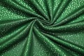 shimmering silver polka dots pattern on green fashion cloth