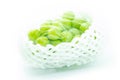 Shine Muscat Grape in packaging and foam cushioning on a white background. Green grapes