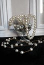 Pearl accessories in wineglass