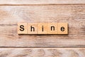 Shine word written on wood block. Shine text on wooden table for your desing, concept Royalty Free Stock Photo