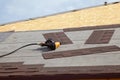 Shingles roof ventilation for heat control with nailgun Royalty Free Stock Photo