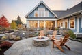shinglestyle home with stone fire pit in the yard Royalty Free Stock Photo