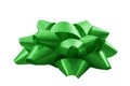 Shining anniversary gift and present decorating silky ornament concept green sleek polished glossy bow isolated on white