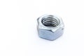 Shining big steel metal hex nut with female thread on white back Royalty Free Stock Photo