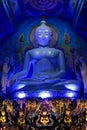 Shining Blue Buddha statue in Wat Rong Suea Ten temple in Thailand