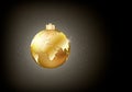 Shining Christmas golden ball with world map on it on dark backgroung with light and star dust. Conceptual vector