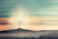 Shining cross on Calvary hill, sunrise, sunset sky background. Copy space. Ascension day concept. Christian Easter Royalty Free Stock Photo