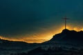 Shining cross on Calvary hill, sunrise, sunset sky background. Copy space. Ascension day concept. Christian Easter