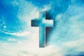 Shining cross in clouds on blue sky. Copy space. Ascension day concept. Christian Easter. Faith in Jesus Christ