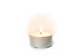 Shining flame on a tea light candle Royalty Free Stock Photo