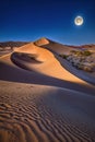 Shining full moon and stars in the night sky. moon and moonlight view over sand dune. Royalty Free Stock Photo