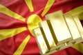 Shining golden bullions on the macedonia flag Royalty Free Stock Photo