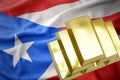 Shining golden bullions on the puerto rico flag Royalty Free Stock Photo
