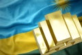 Shining golden bullions on the rwanda flag Royalty Free Stock Photo