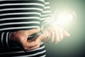 Shining light bulb in female hand Royalty Free Stock Photo