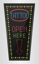 Shining retro light banner tattoo open here on a black background