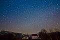 Shining star tracks in clear deep blue night sky of Carpathian Mountains in Transcarpathia, fabulous countryside landscape Royalty Free Stock Photo