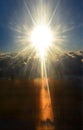 Shining sun above stormy clouds. Day & night. Royalty Free Stock Photo