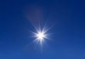 Shining sun at clear blue sky with copy space Royalty Free Stock Photo