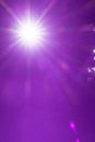 Shining sunlight & sun ray flares with bokeh light on violet purple sky Royalty Free Stock Photo