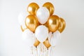 Shining white and gold balloon with a touch of elegance floating on a clean white background Royalty Free Stock Photo