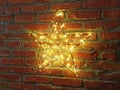 Shining yellow star on a wall