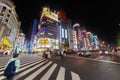 View of cityscape at night with colorful advertisement billboard light beside the street