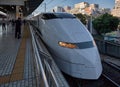 Shinkansen bullet train of 300 series stopping at the planform of railway station. Kyoto. Japan Royalty Free Stock Photo