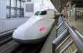 Shinkansen bullet train waiting for passengers at the platform