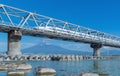 Shinkansen train. Fast bullet train, driving and passing Mountain Fuji near Tokyo railway station with steel bridge over Fuji Royalty Free Stock Photo