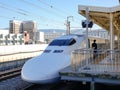 Shinkansen train stopping at station in Nagoya, Japan