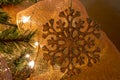 Shinny and golden snowflake Christmas ornament. Gold bakground mesh Royalty Free Stock Photo