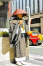 Shinto monk ringing bell for donation Royalty Free Stock Photo