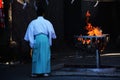 Shinto priest and bonfire