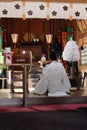 A Shinto priest leading a ritual at Onechi Shrine.