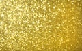 Abstract gold glitter background, defocused