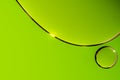 Shiny abstract green background, oil drops in water, green bubbles Royalty Free Stock Photo