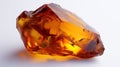 shiny amber gemstone on white background Royalty Free Stock Photo